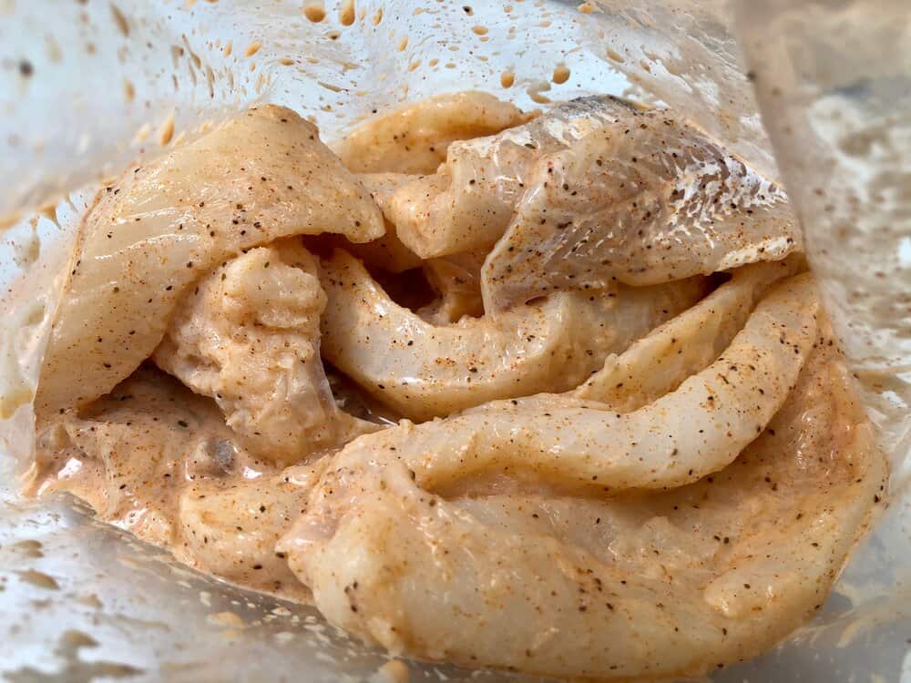Fish marinating in a plastic bag