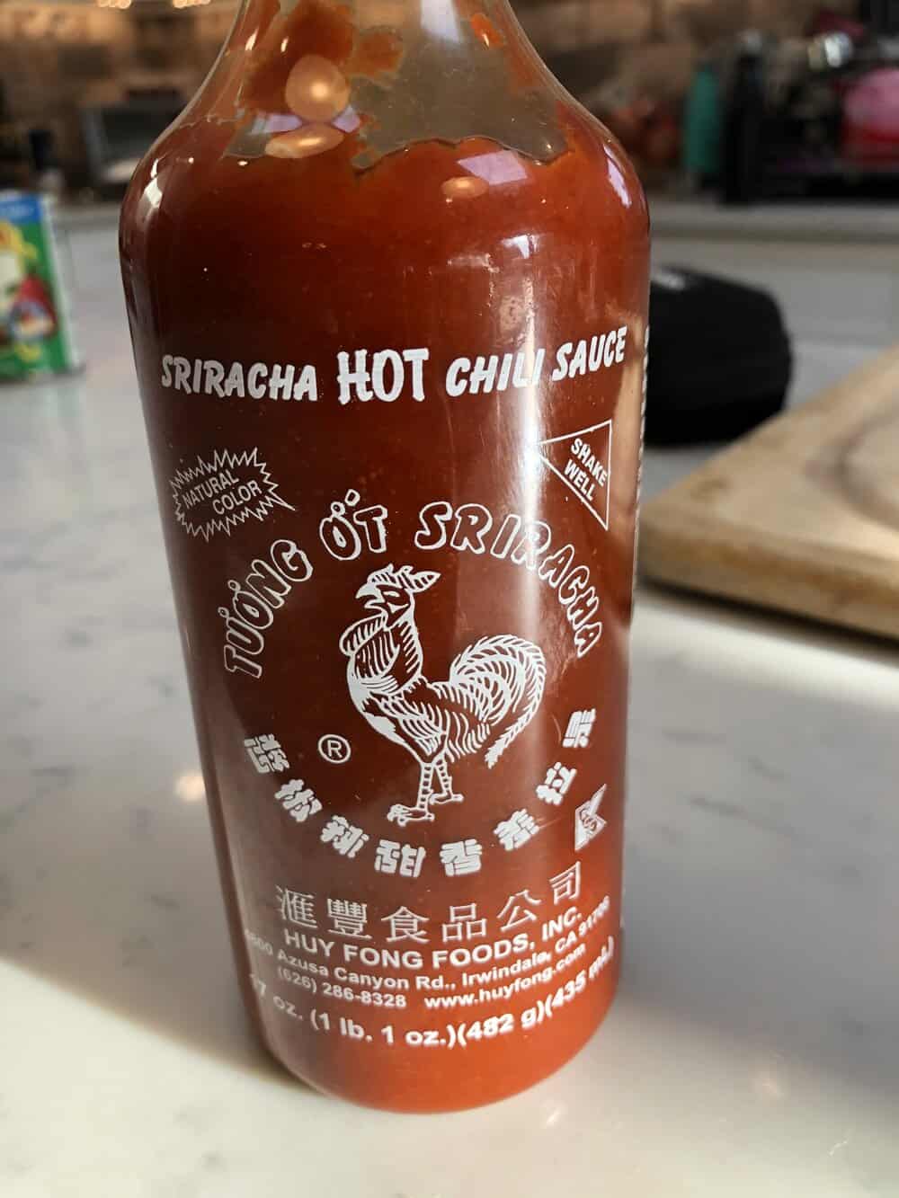 A bottle of sriracha