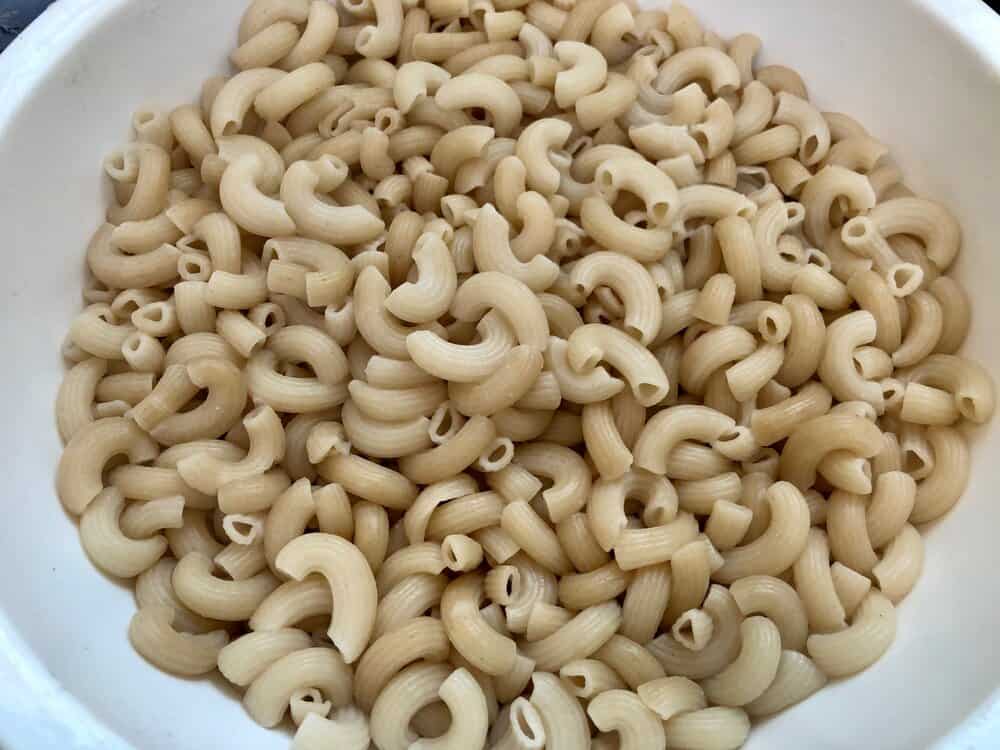 Brown rice elbow macaroni in a strainer
