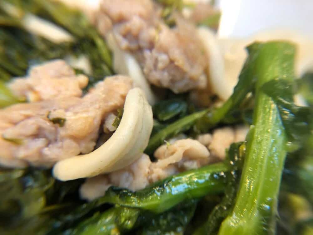 Close up of orecchiette with broccoli rabe and sausage