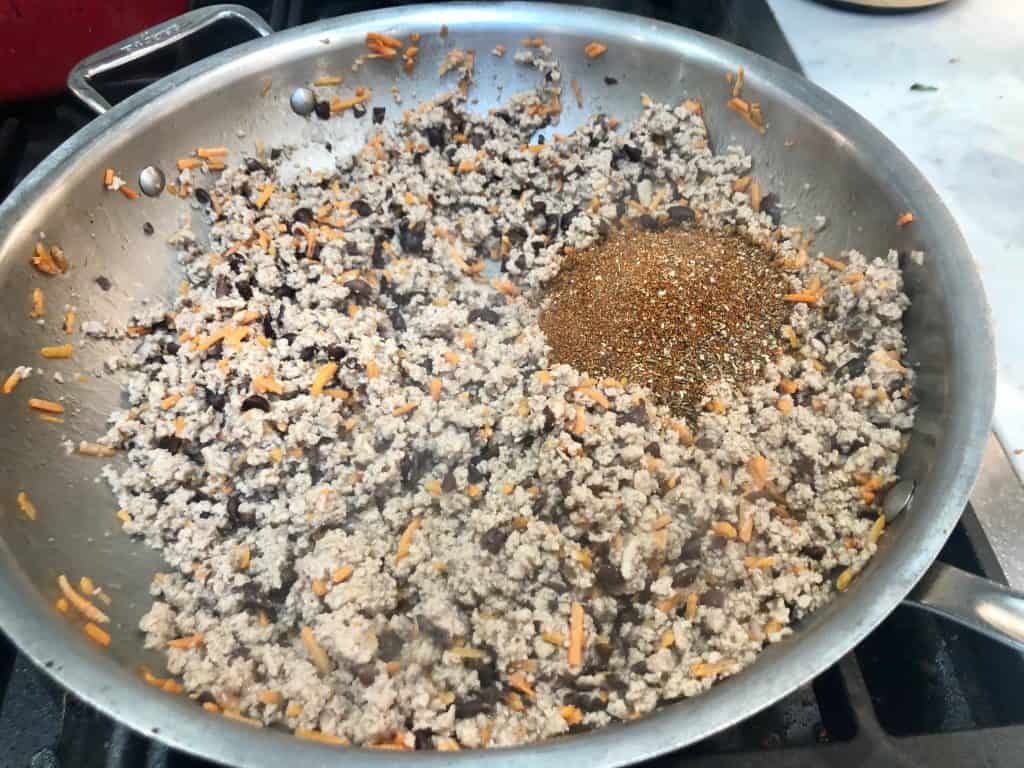 Seasoning added to ground turkey