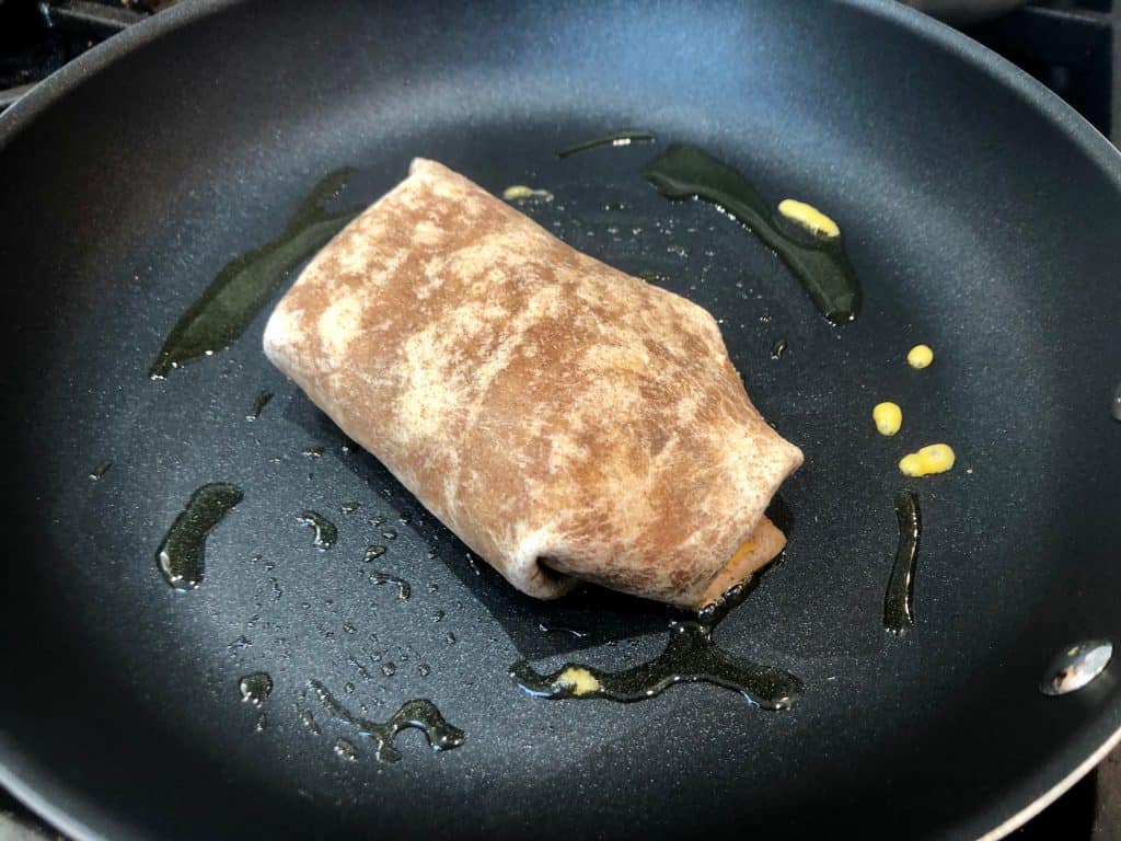 Burrito toasting in a pan