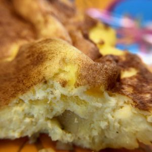 Closeup of cheesy potato and egg frittata