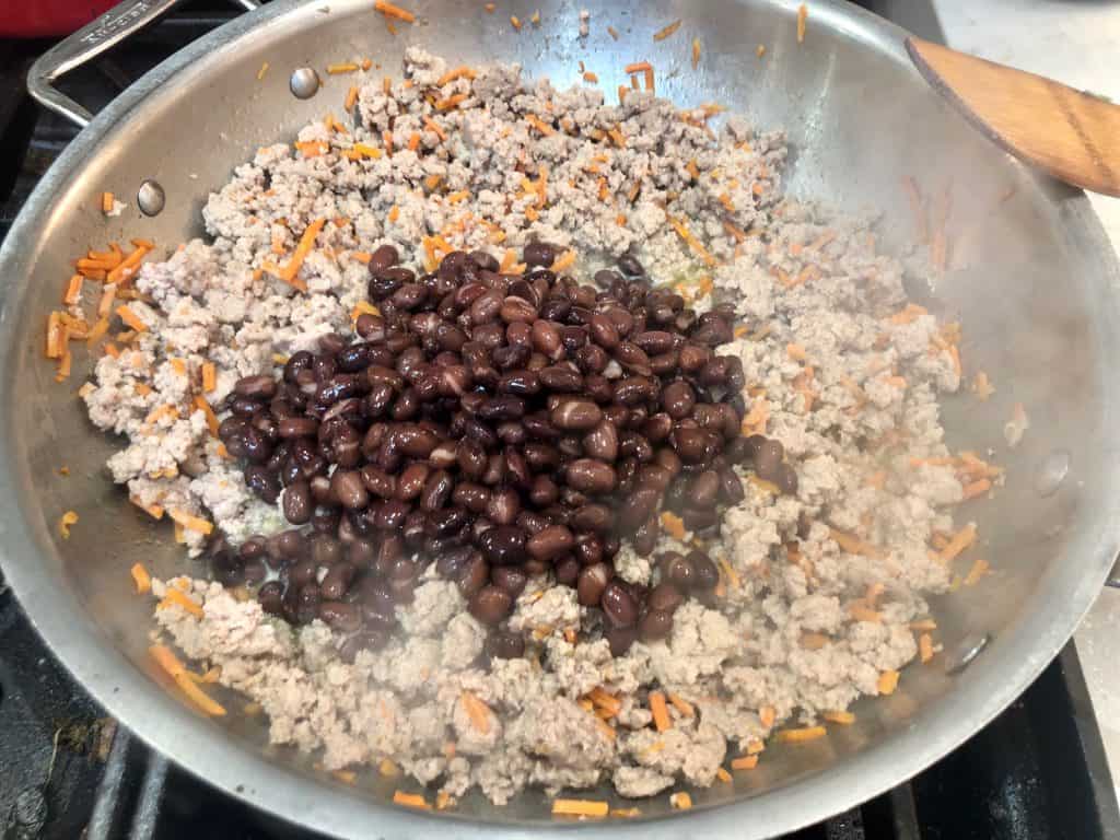 Black beans cooking with ground turkey
