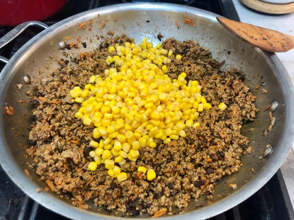 Corn added to seasoned meat