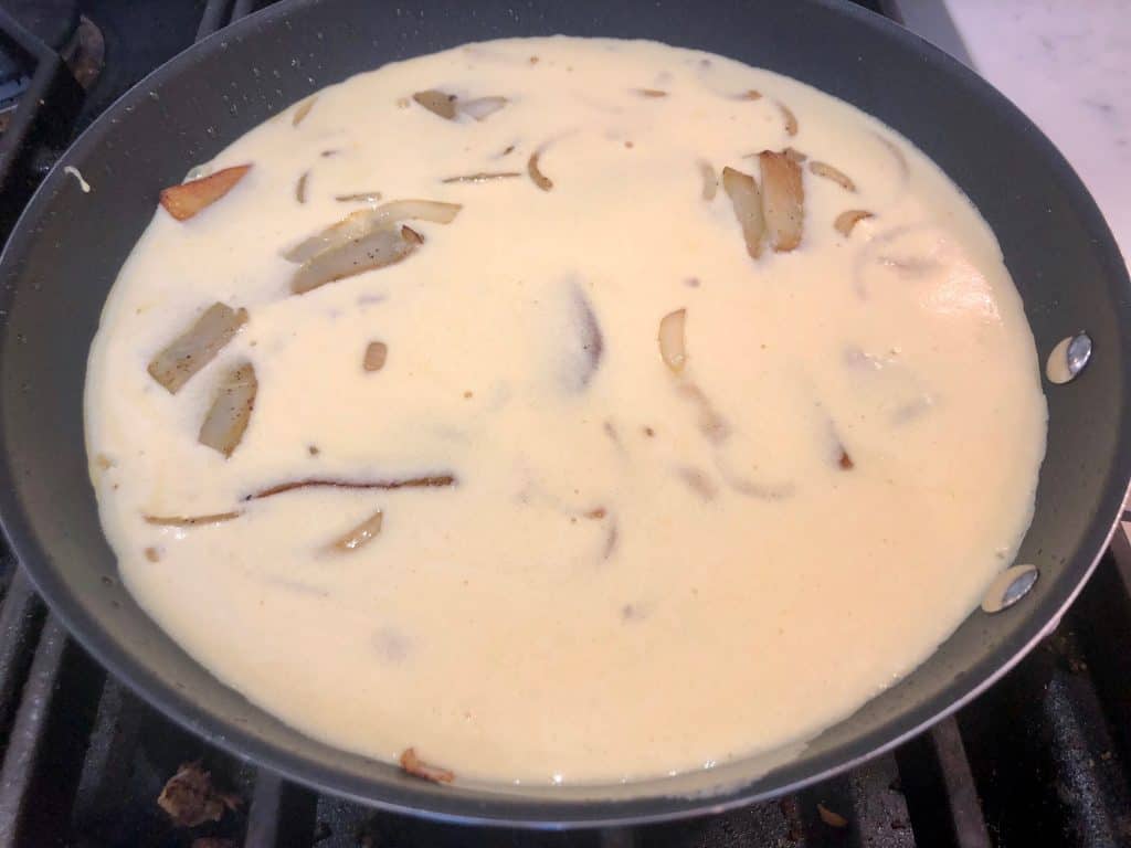 Potatoes and eggs in a pan