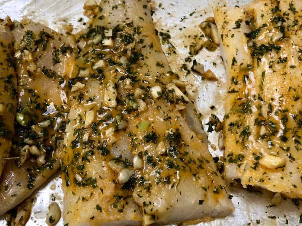 Cod marinating on a pan