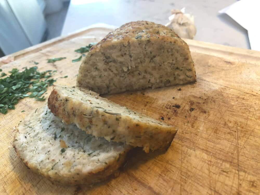 Chicken meatloaf cut up on a cutting board