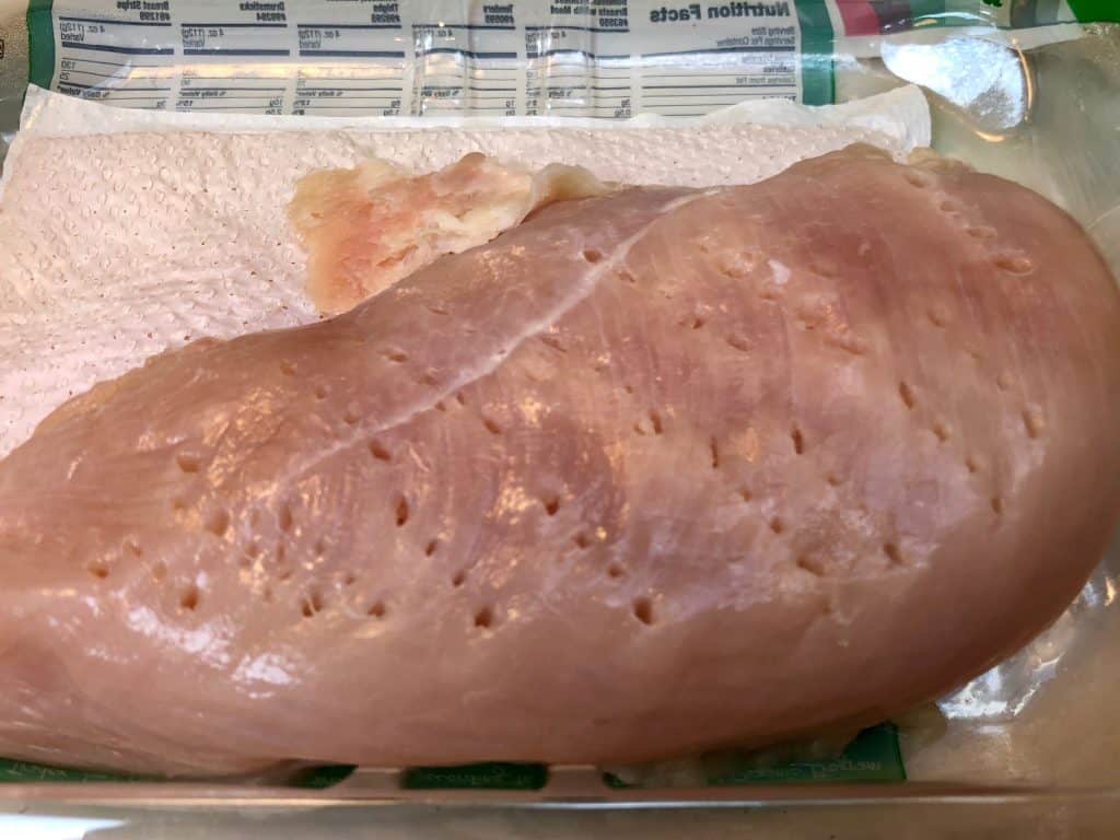 Chicken breasts poked with fork holes