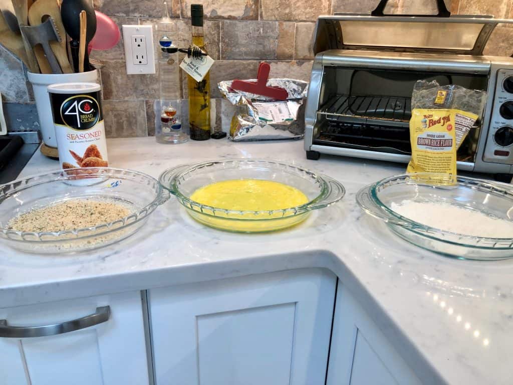 Flour, egg, and breadcrumb in separate bowls