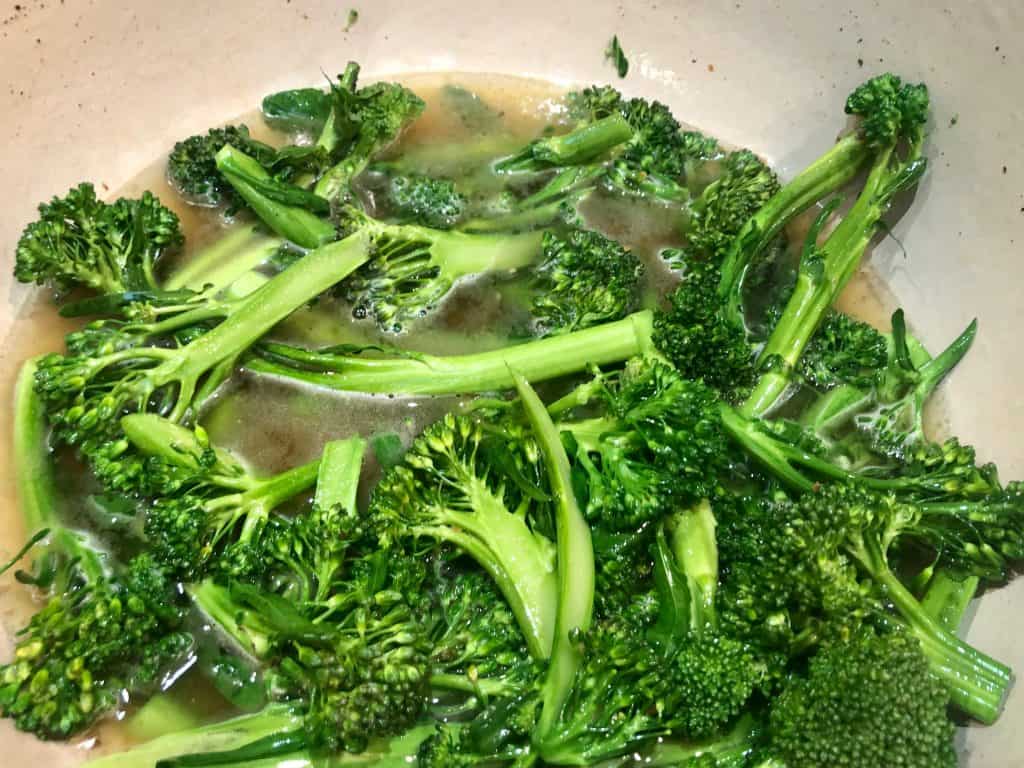 Broccolini cooking in liquid