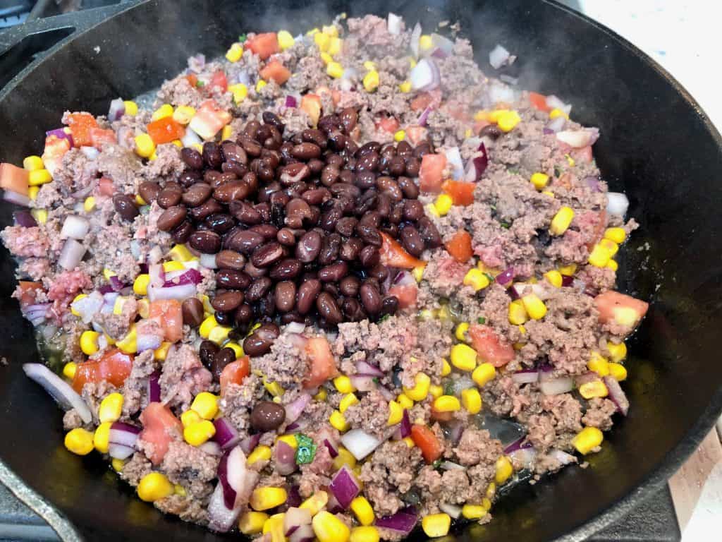 Black beans with ground beef and salsa in a skillet