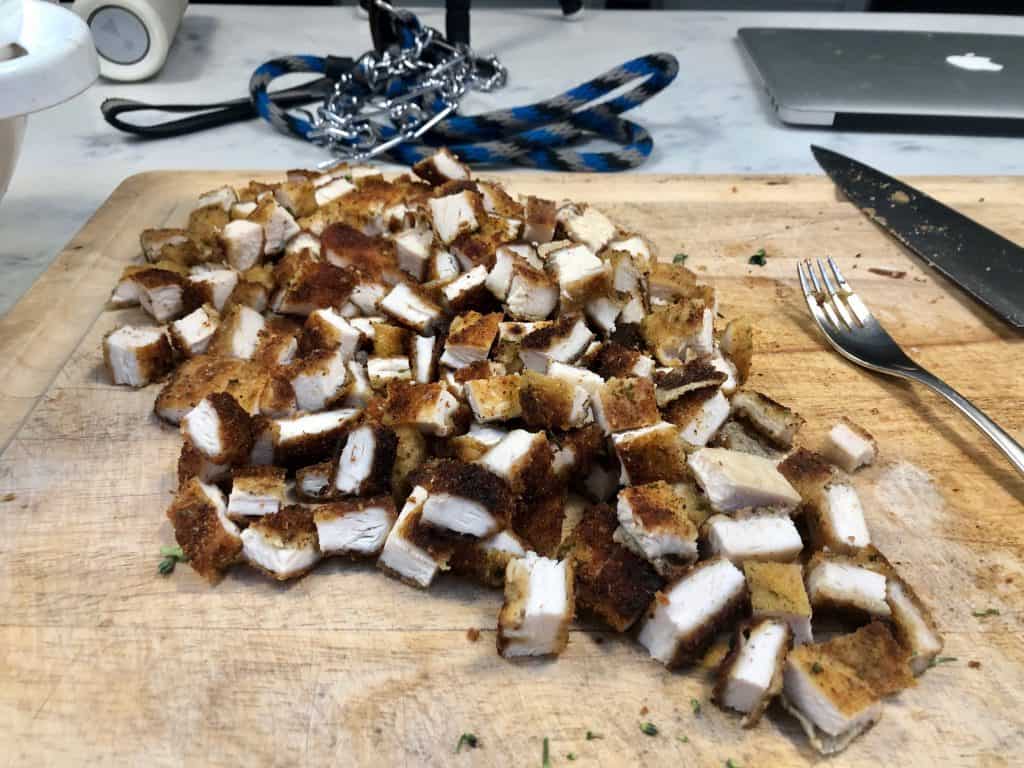 Chopped chicken cutlets on a cutting board