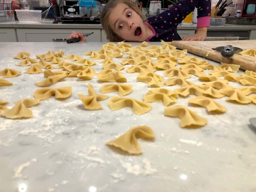 Homemade Farfalle drying on a table