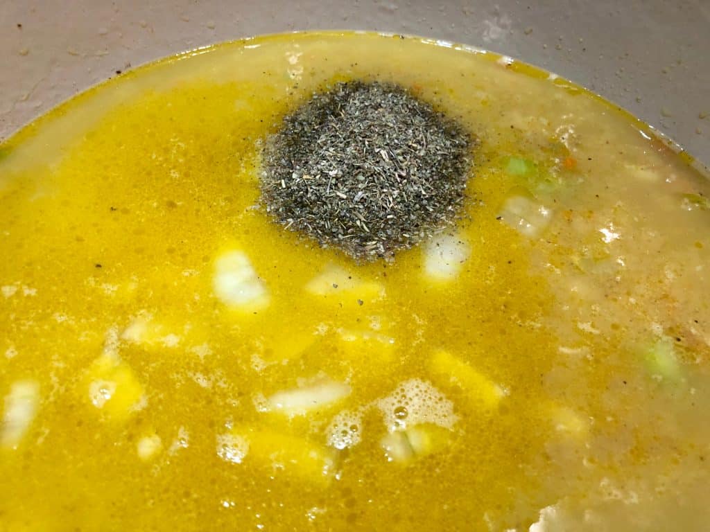 Chicken broth and seasoning cooking