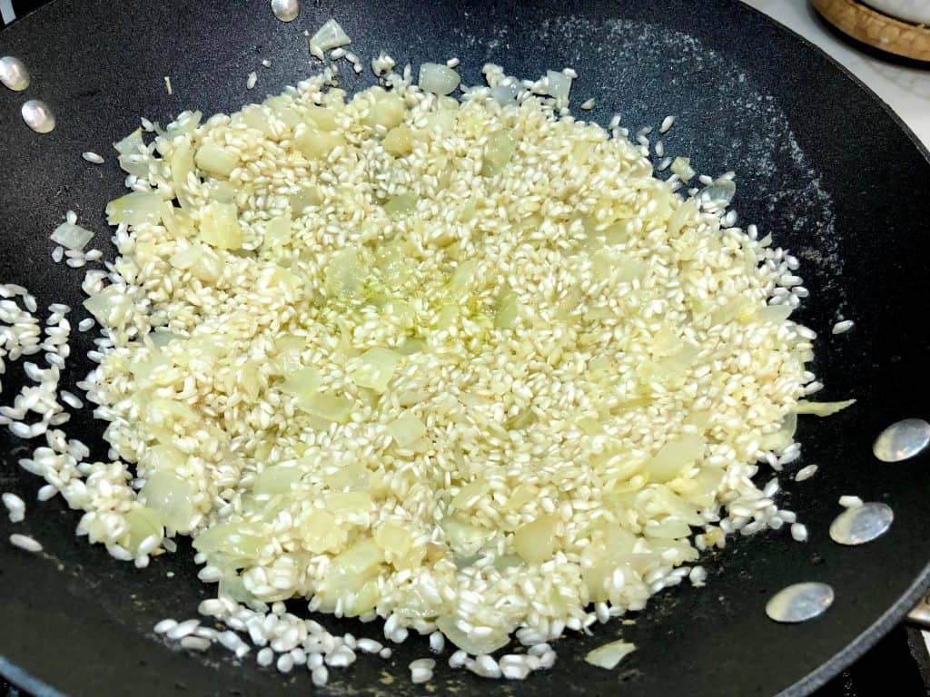 Rice and wine cooking with onions