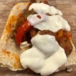 Sausage and peppers sandwich with mozzarella