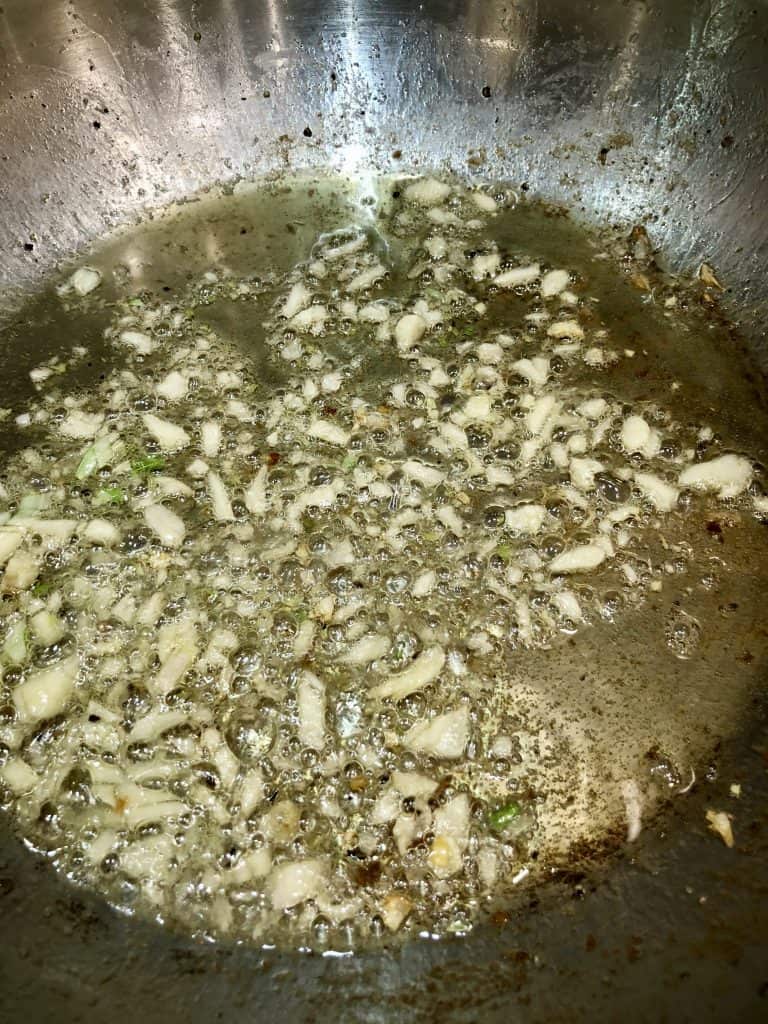 Garlic frying in a pan
