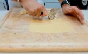 Cutting homemade lasagna pasta